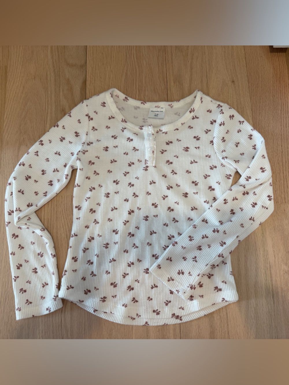abercrombie kids white waffle knit long sleeve top with mauve bow print